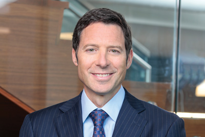 Headshot image of the President and CEO of BrightSpring Health Services, Jon Rousseau