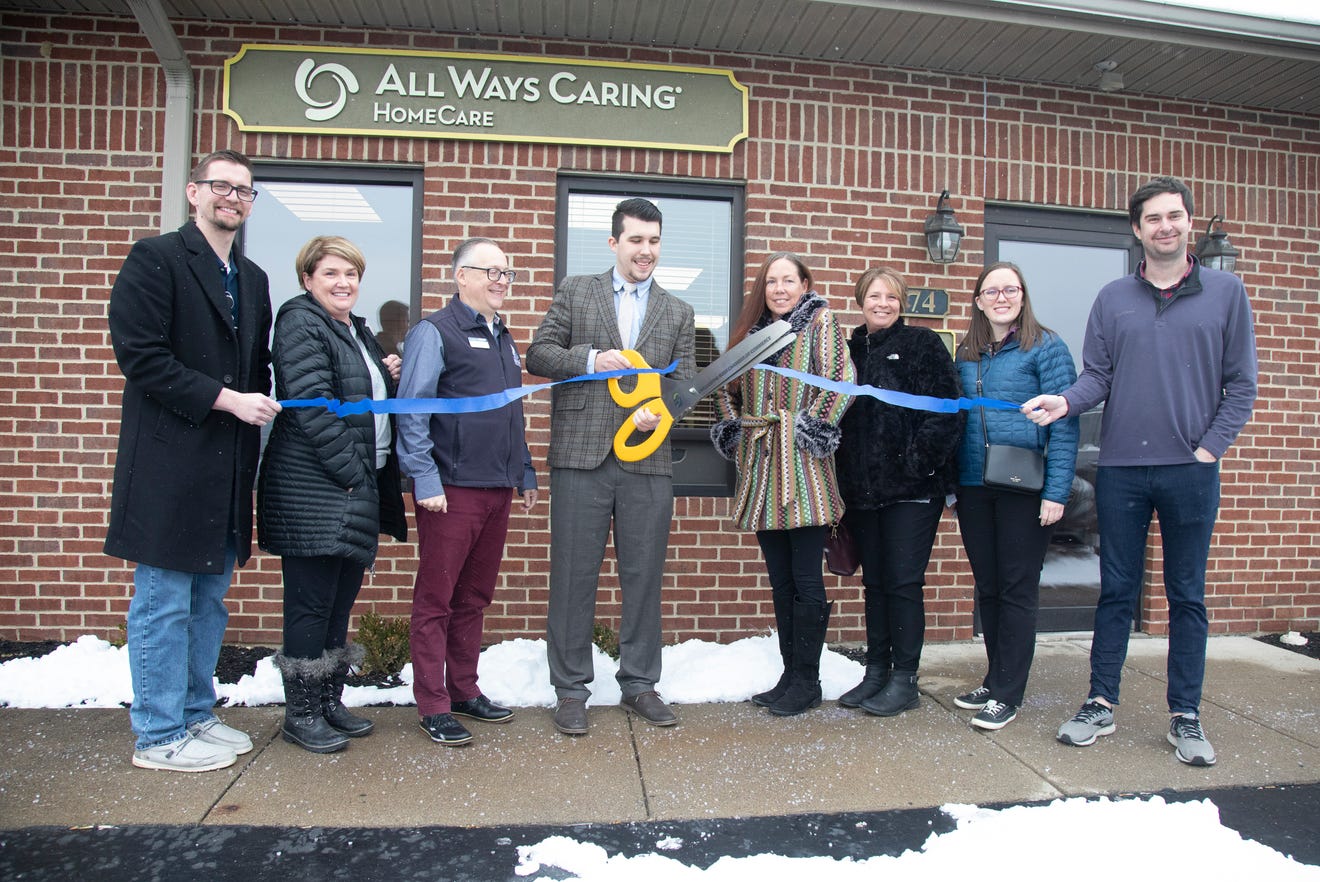 All Ways Caring Home Care branch manager Chase Thurber cuts the ribbon for their grand opening in Chillicothe, OH